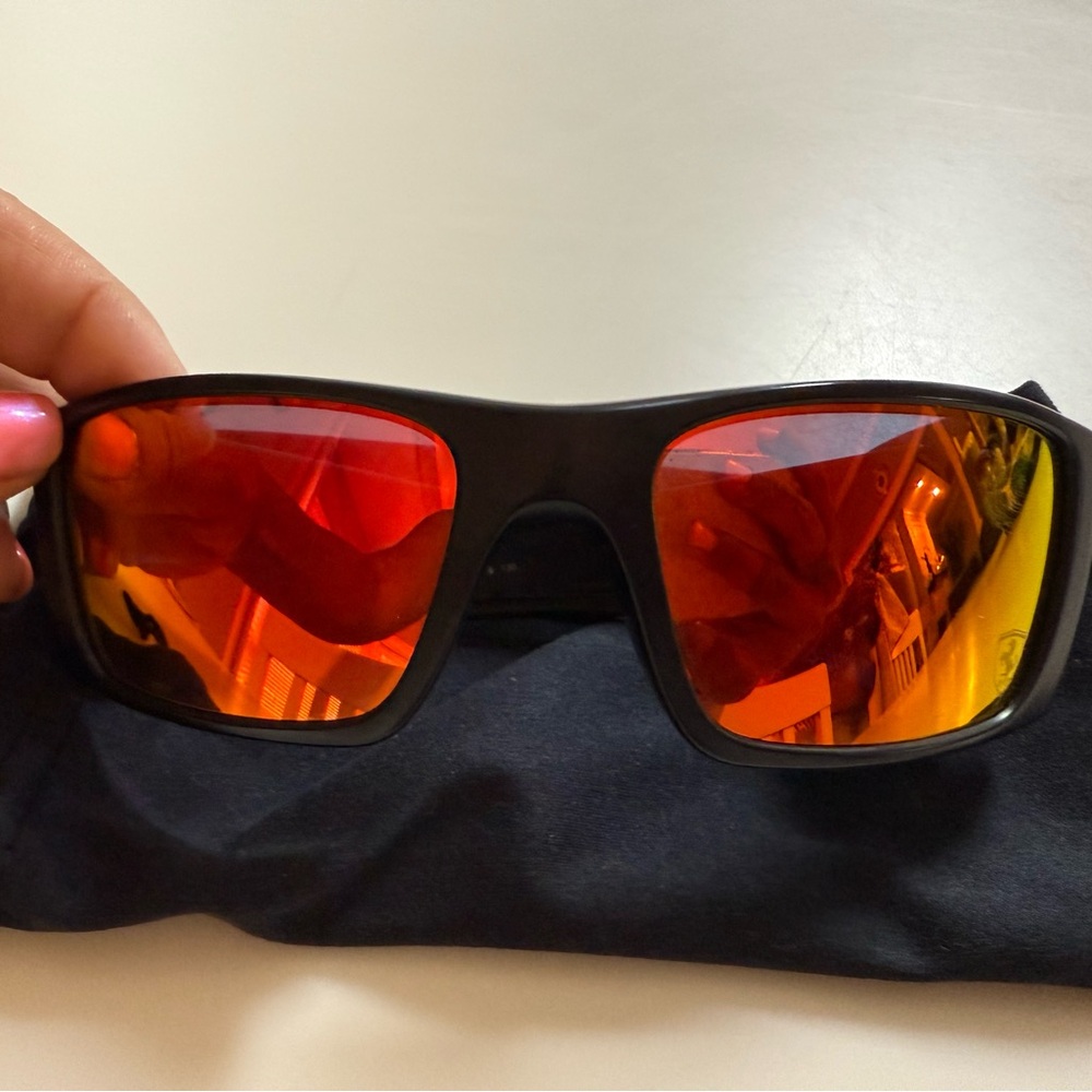 Used Oakley Black and Red Lens Sunglasses